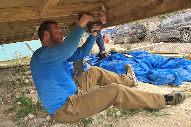 NYIT students hard at work reinforcing roofs, doing light framing, and installing hurricane clips for new homes for displaced families in Puerto Rico.
