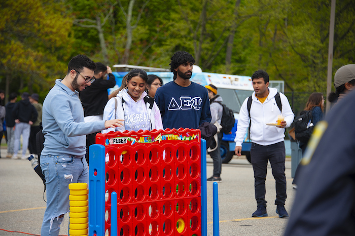 Opponents go head to head in a jumbo-sized version of the game of Connect Four on the Long Island campus.