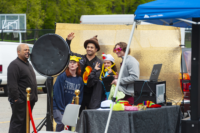 Students pose for pictures at a photo booth on the Long Island campus.