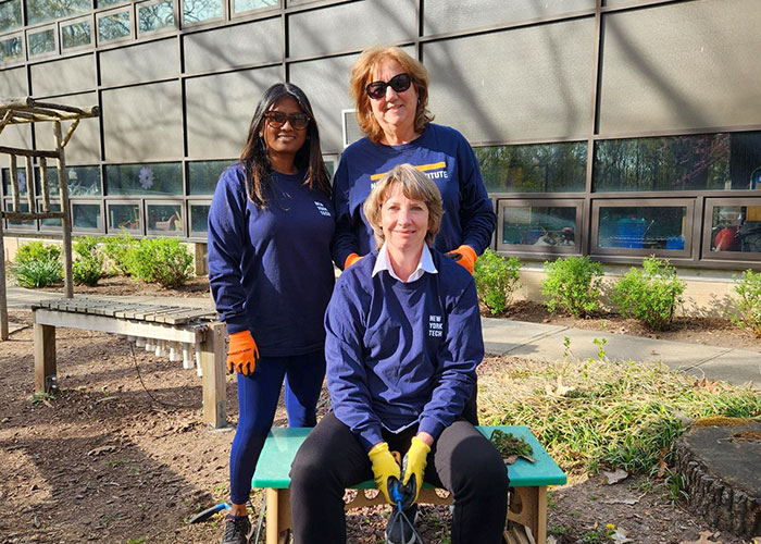 Pictured clockwise from left: Nirvaarni Matheora, associate director of the Academic Health Center; Phyllis Pugliese, supervisor at the Academic Health Center, helped clean and beautify and outdoor classroom for the Developmental Disabilities Institute; and Marie Pierre Hornosky, associate director of finance at the College of Osteopathic Medicine
