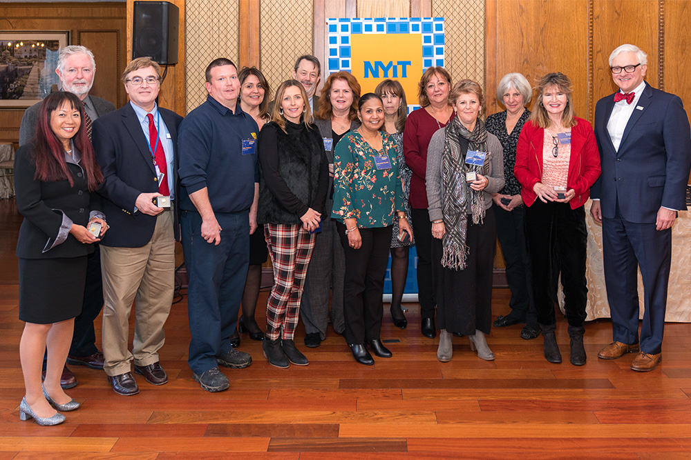 20 Years of Service: Constance Canning, Alice Dolitsky, Claude Gagna, Eileen Gillespie, Esther Hevia, Kevin LaGrandeur, Kimberly Margan, Kelly McKenna, Seth McQulae, Lisa Moore, Indrawatie Nandlal, Victoria Pfeiffer, Phyllis Pugliese, Jeanne Stausman, featuring Hank Foley, Ph.D., president of New York Institute of Technology