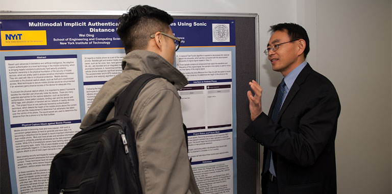 Wei Ding, Ph.D., assistant professor of computer science, explains his research.