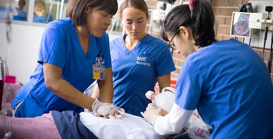 Nursing students resuscitating simulated patient 
