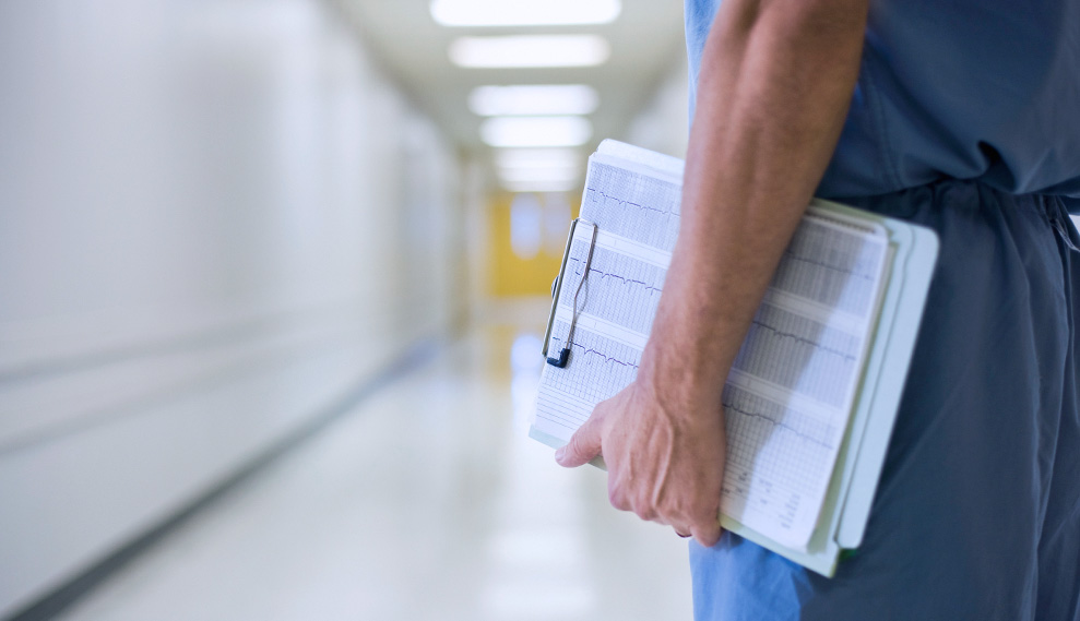 Clinical Education student holding a clipboard 