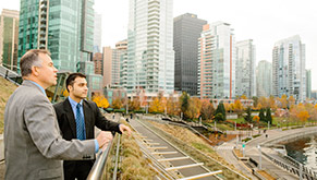 Two faculty members near NYIT's campus in Vancouver, Canada
