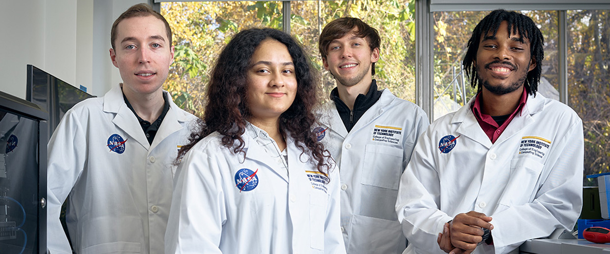 Group of students wearing NASA scientist jackets.