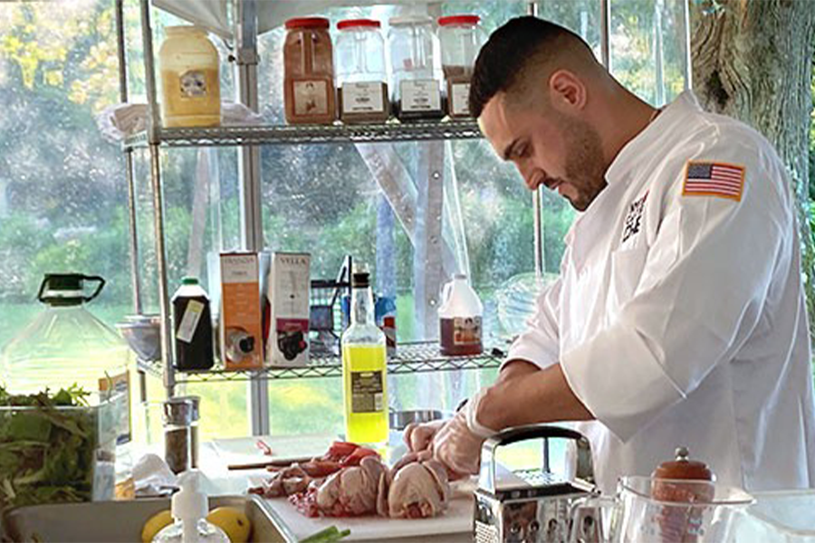 Cast Iron Chef competitor cutting meat