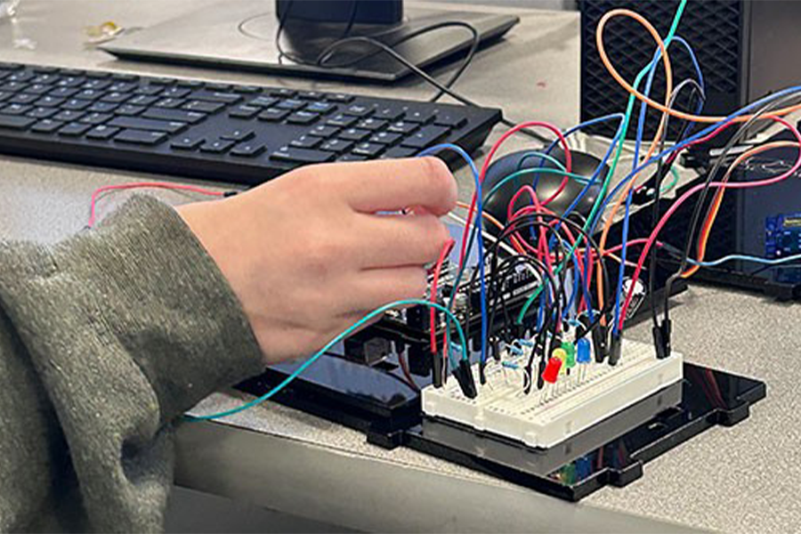 Hands handling wires