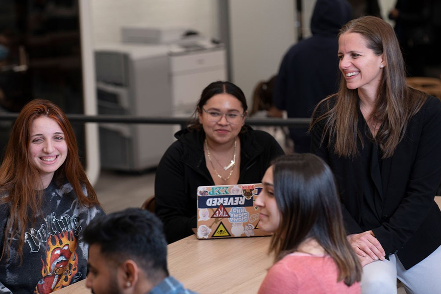 Advisor with students on the Long Island campus