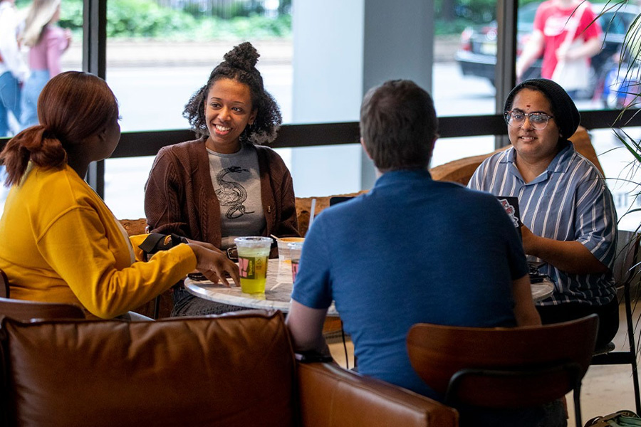 New York Tech students sitting at a table