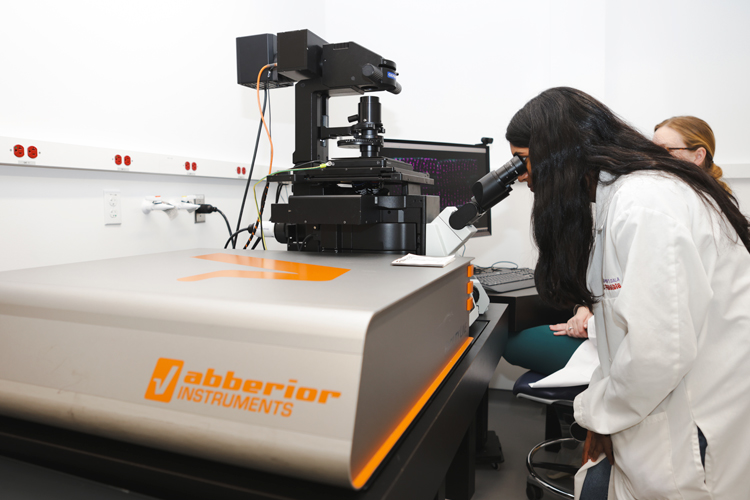 A researcher uses the BRIIC’s 3-D STED microscope, which allows a more precise view of cellular structures and processes.
