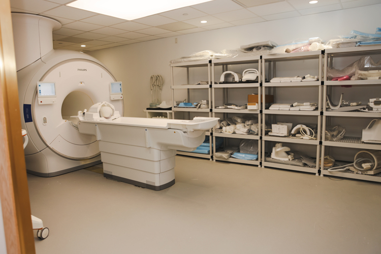 The fMRI machine, shown here, offers a non-invasive solution for analyzing brain abnormalities.