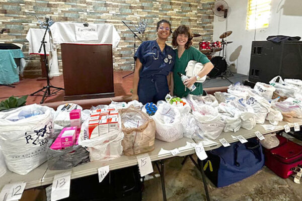 Two medical students overseeing donation bags.