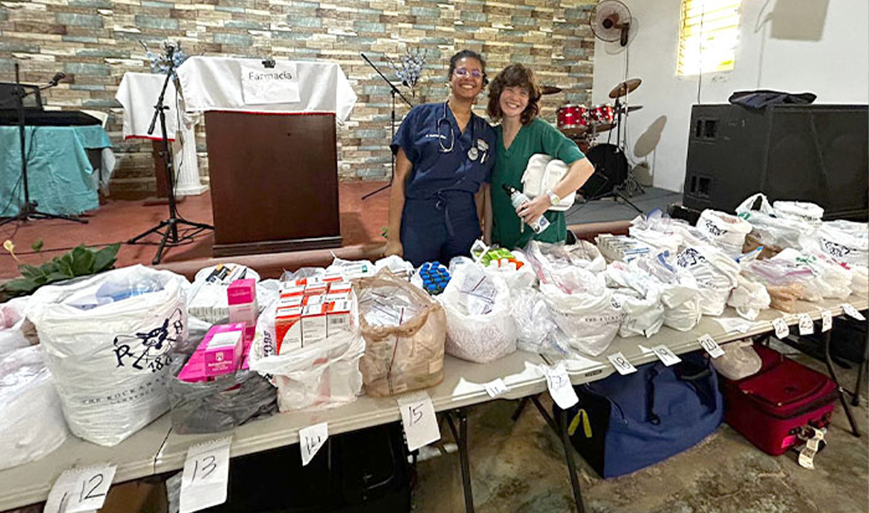 Two medical students overseeing donation bags.