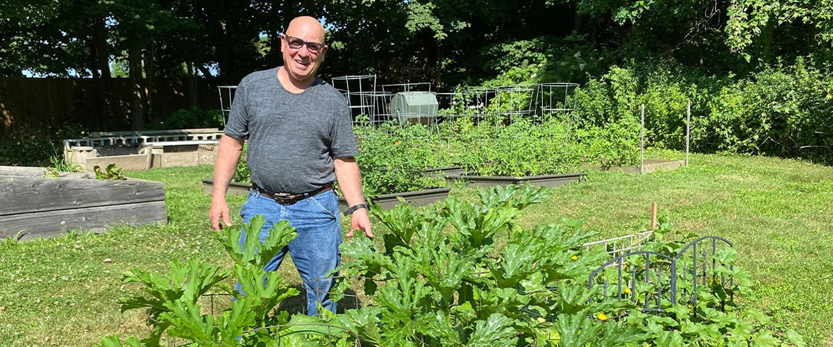 James O'Rourke next to a plant