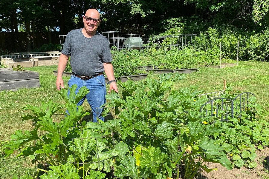 James O'Rourke next to a plant