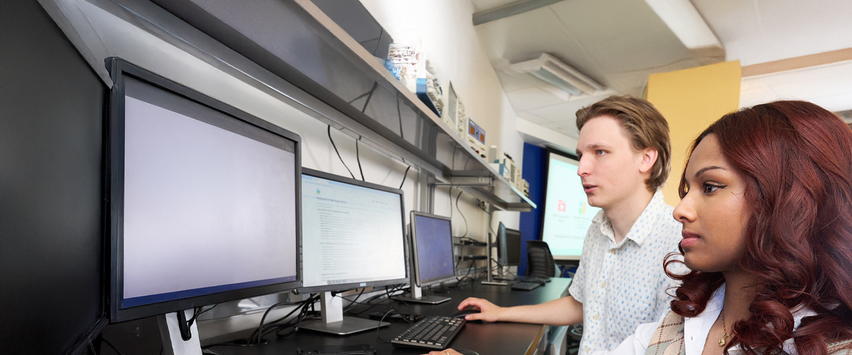 Two students working at computers
