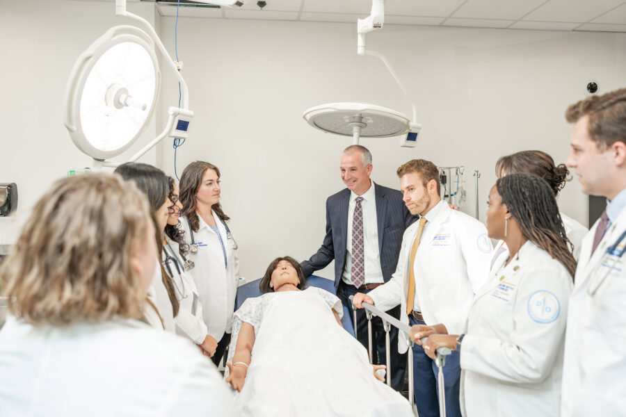 Shane Speights teaching students in a medical simulation lab