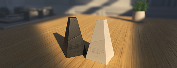 Artwork of geometric shapes shown on a wooden tabletop.