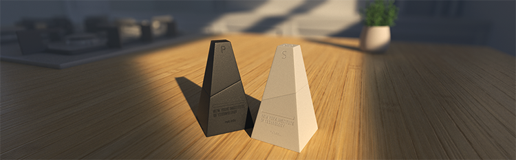 Artwork of geometric shapes shown on a wooden tabletop.