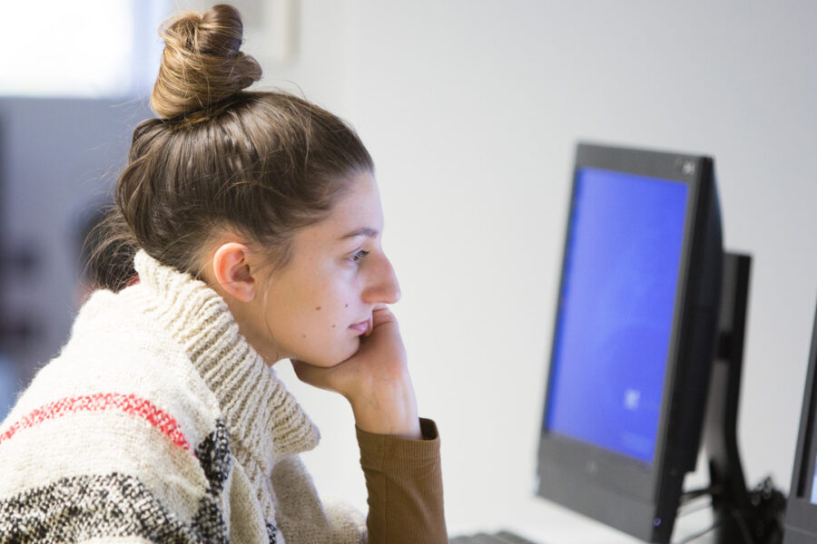 A student worker uses a computer