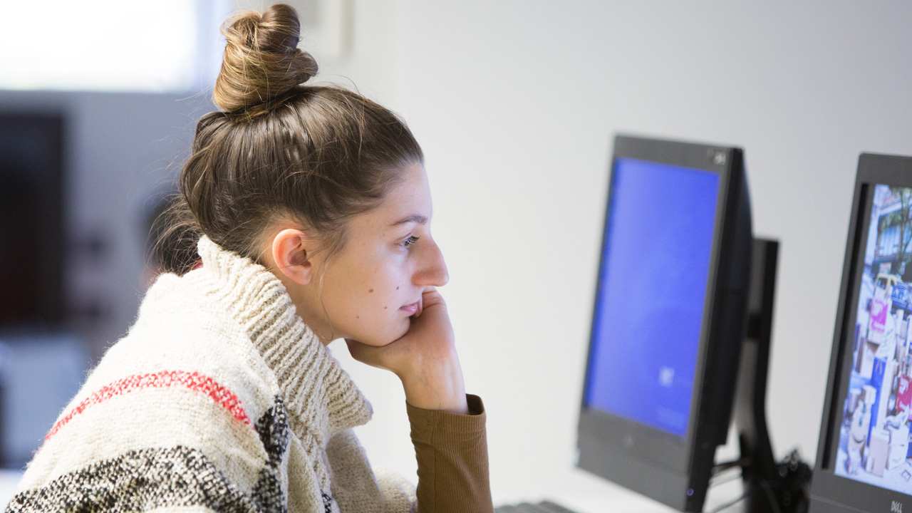 A student worker uses a computer