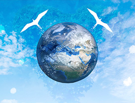 A globe of Earth with two white birds