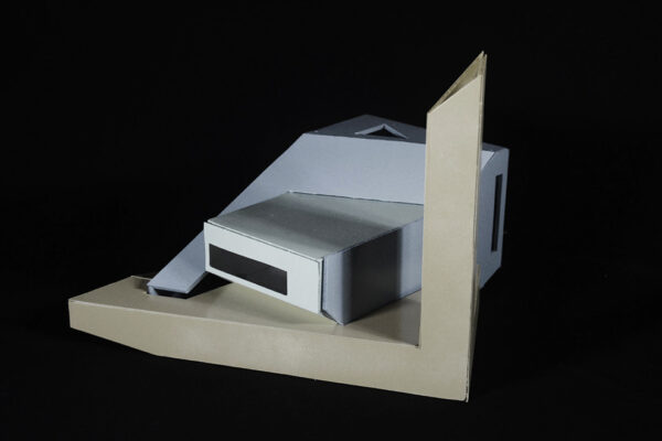 A photo of an architectural model of a small modern structure