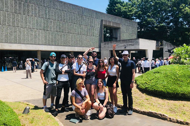 A photo of a group of study-abroad students posing in front of the National Museum of Western Art in Ueno Park, Tokyo, Japan.
