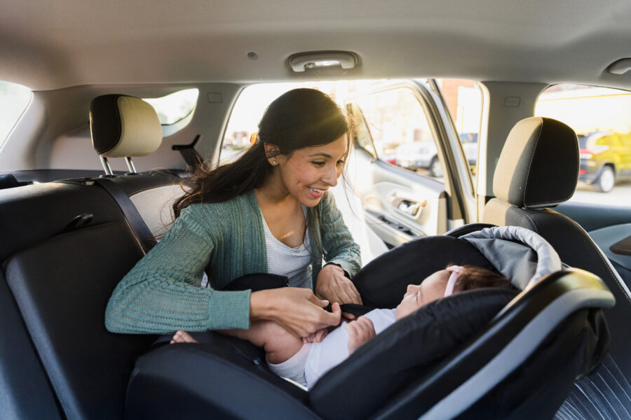 Photo of a woman and baby in a car