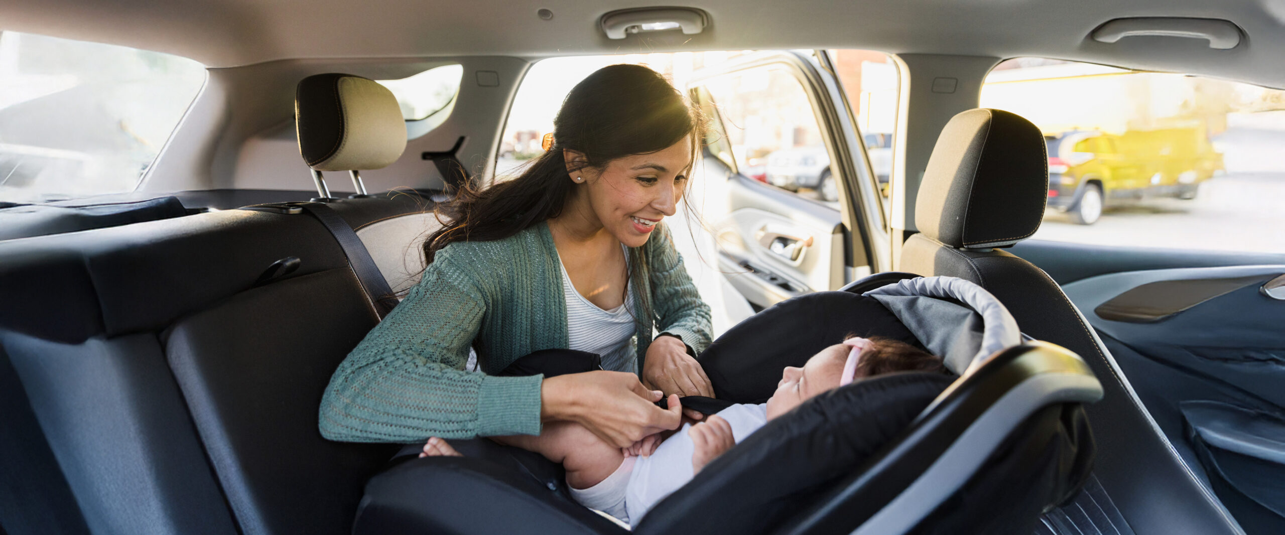 Photo of a woman and baby in a car