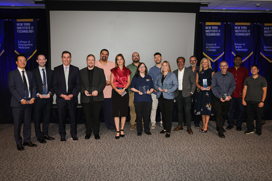 President Jerry Balentine with group of people holding awards