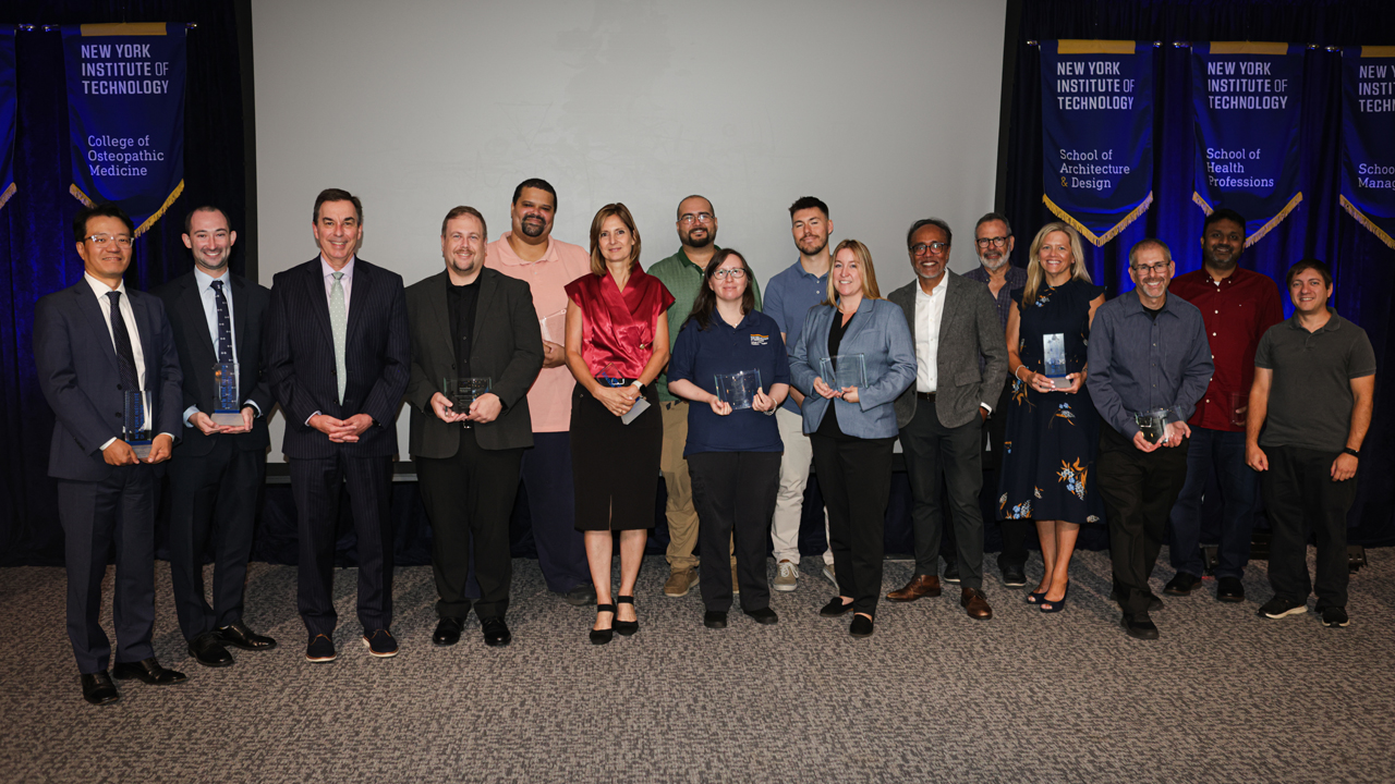 President Jerry Balentine with group of people holding awards