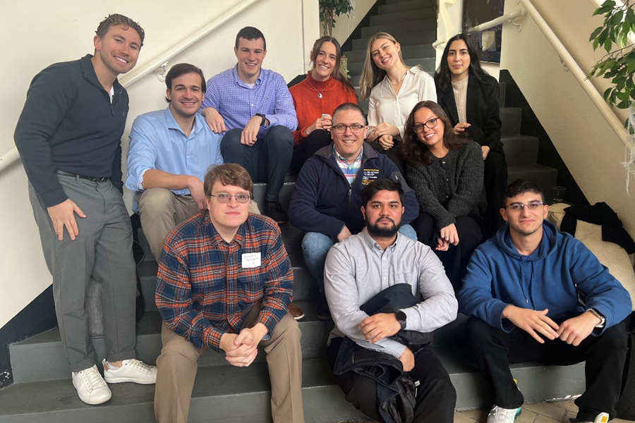 Lab members sitting on steps