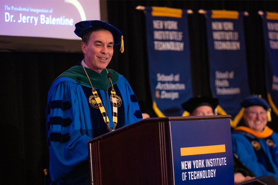 President Jerry Balentine speaking at podium