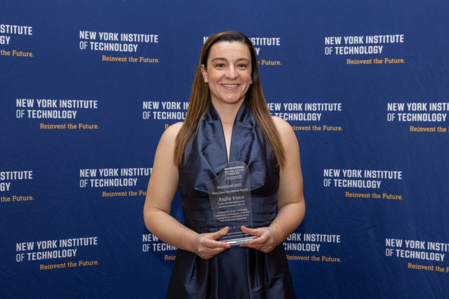 Andra Voicu holding an award