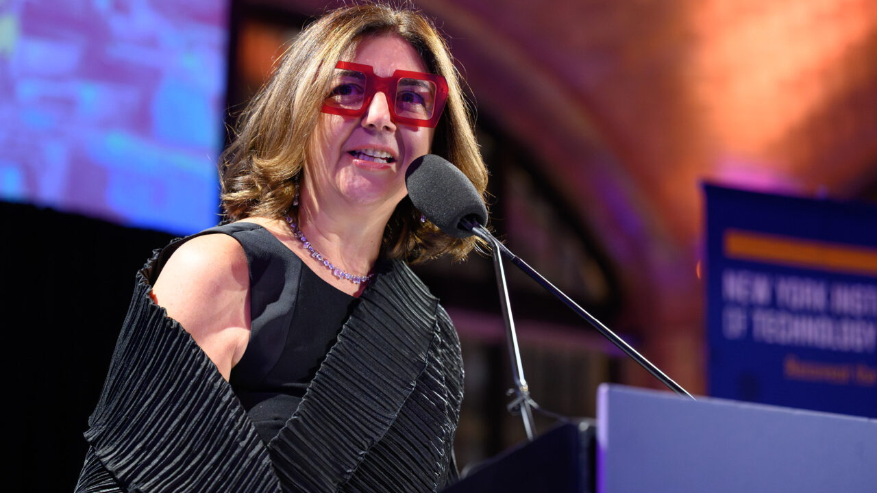 Dean Maria Perbellini speaking at a podium