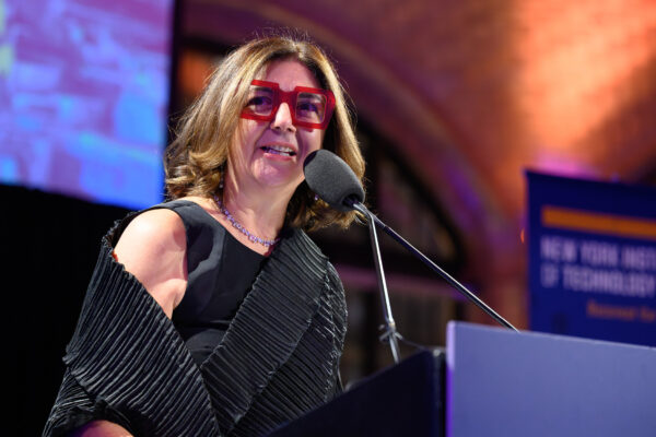 Dean Maria Perbellini speaking at a podium