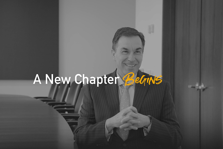 President Jerry Balentine answers questions in a conference room.