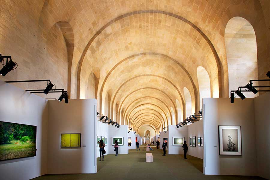 A gallery in a curved stone building