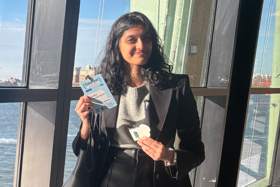 Neethu Thalappan Koroth holding a badge