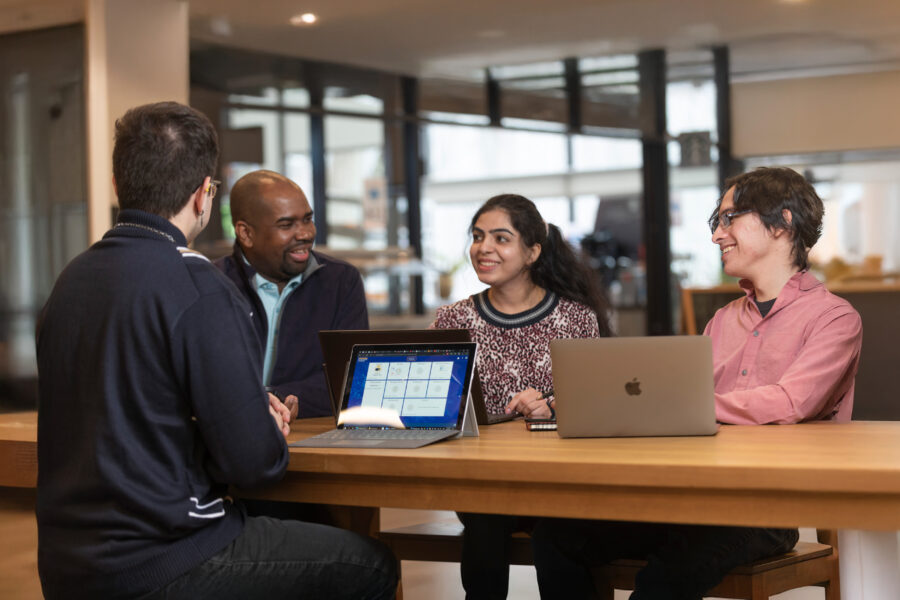 People sitting around a table talking.