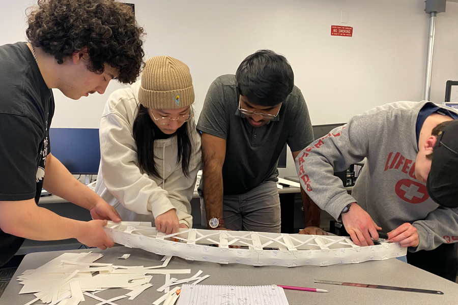 Students building a bridge model