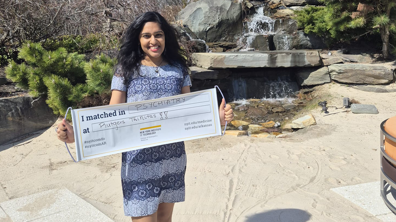 Mereena Jolly holding sign with her match