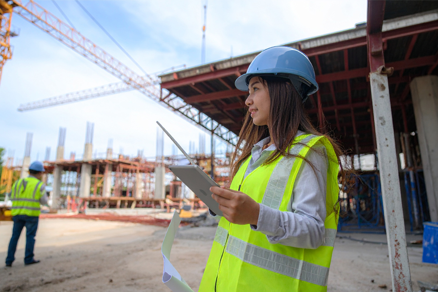 Woman wearing a hard hat on a construction site