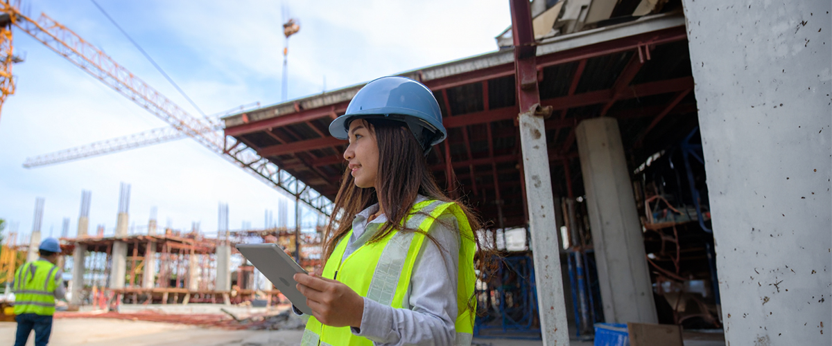 Woman wearing a hard hat on a construction site