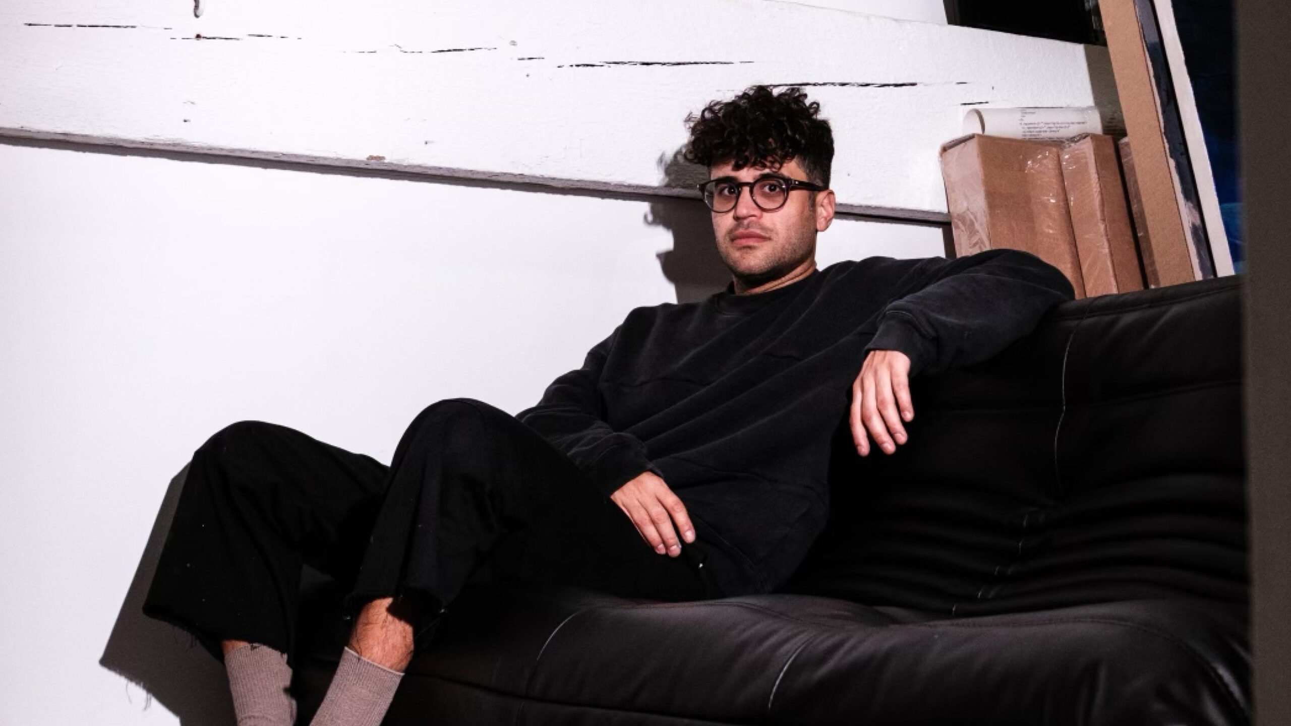 Ricardo Cabret sitting on a couch