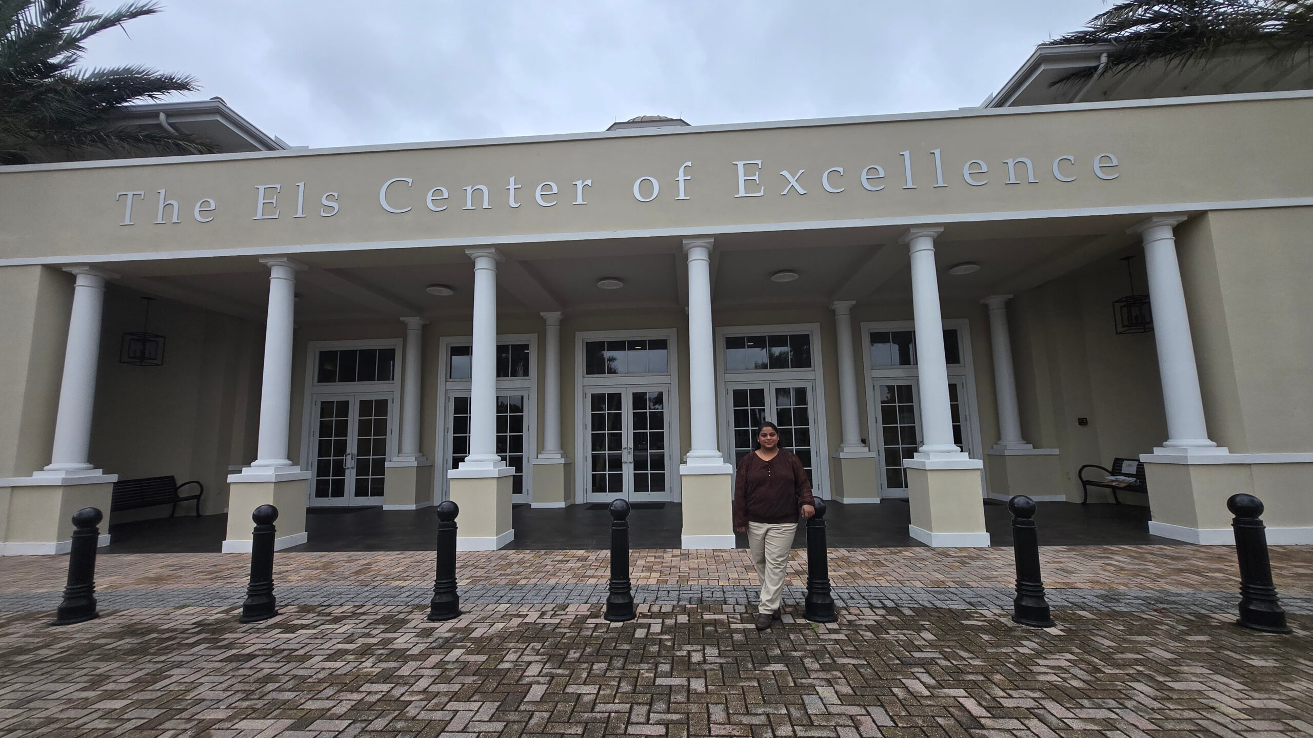 Rajeshri Nadar standing outside the building