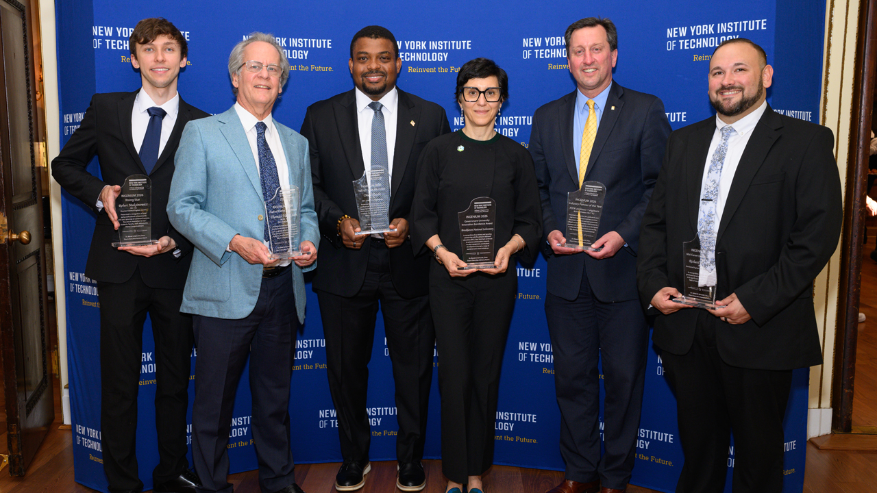 Award winners holding plaques