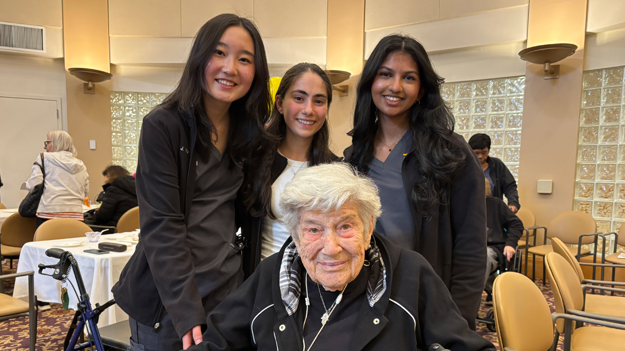 NYITCOM students with assisted living resident